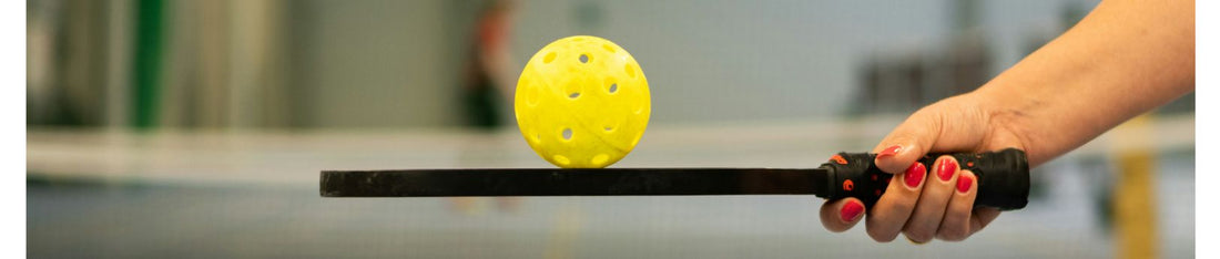 Pickleball ball on Pickleball Paddles