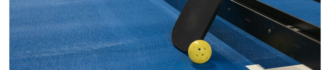 Pickleball Paddle with Ball On The Court